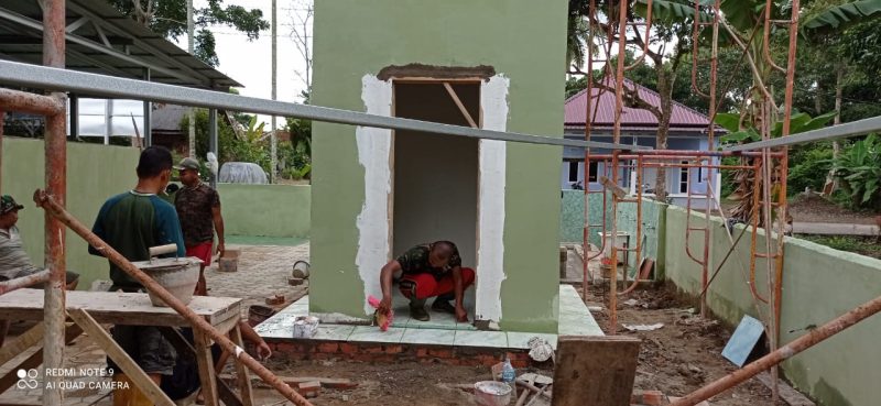 Pemasangan Keramik di Menara Masjid Nurul Iman