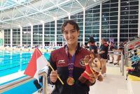 Perenang Indonesia, Masniari Wolf meraih medali emas di nomor 50m gaya punggung putri
