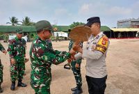 Menjelang pelaksanaan upacara penutupan TNI Manunggal Membangun Desa [TMMD] ke-129 Kodim 0418 Palembang, personel Satgas TMMD bersama jajaran Polri melaksanakan gladi upacara di lapangan sepak bola Kelurahan Talang Jambe, Kecamatan Sukarami, Kota Palembang, Rabu 12 Agustus 2026.