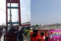 Antusiasme warga menyaksikan Festival Perahu Bidar 2026 memadati kawasan Jembatan Ampera dan tepian Sungai Musi, Palembang meski terik matahari menyengat.