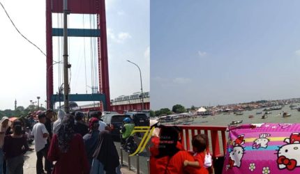 Antusiasme warga menyaksikan Festival Perahu Bidar 2026 memadati kawasan Jembatan Ampera dan tepian Sungai Musi, Palembang meski terik matahari menyengat.