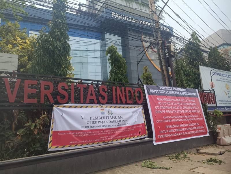 Salah satu objek Yayasan STIMIK IGM yang dipasang plang banner. [Ist]